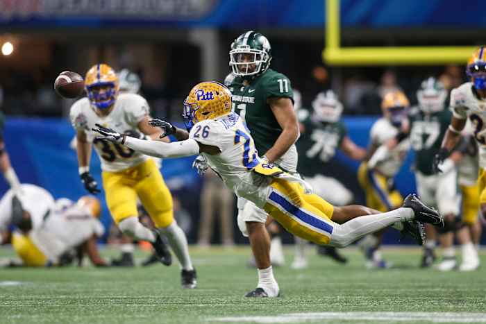 Dec 30, 2021; Atlanta, GA, USA; Pittsburgh Panthers defensive back Judson Tallandier (26) reaches for a ball against the Michigan State Spartans in the second half during the 2021 Peach Bowl at Mercedes-Benz Stadium.